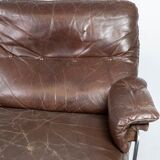 Two seater sofa upholstered with patinated brown leather and frame in metal, designed by Arne Norell