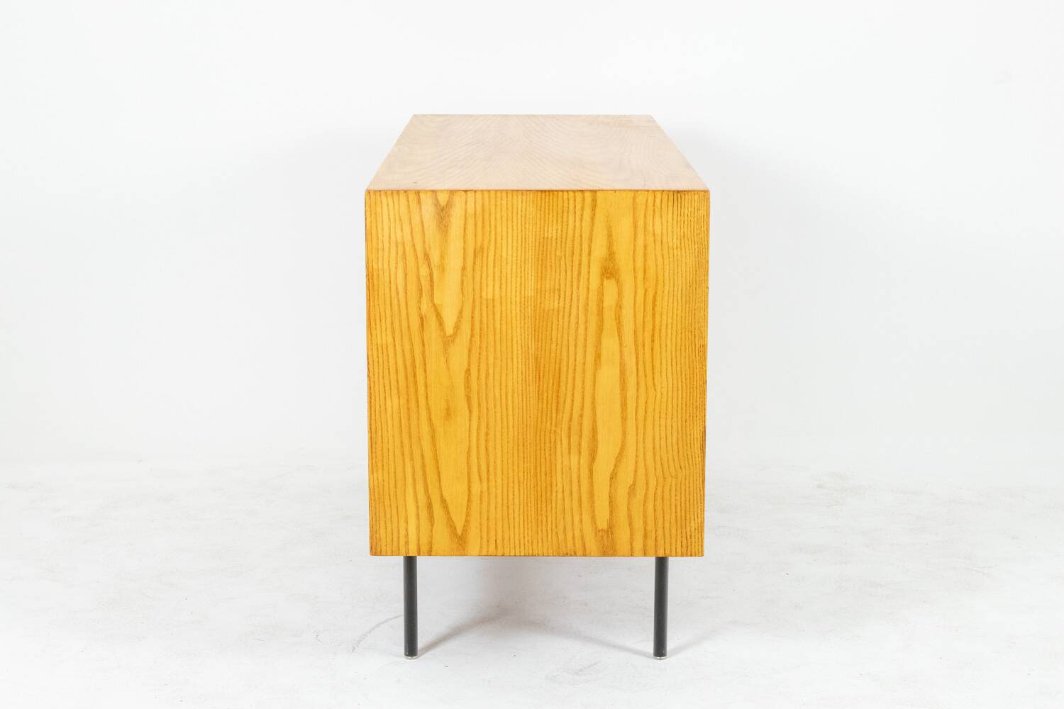 Low ash sideboard with sliding doors. 1960s.