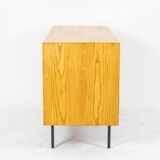 Low ash sideboard with sliding doors. 1960s.