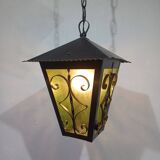 Wrought iron and green glass lantern