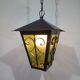 Wrought iron and green glass lantern
