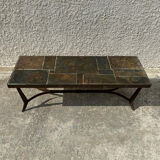 Coffee table with stone top and iron legs