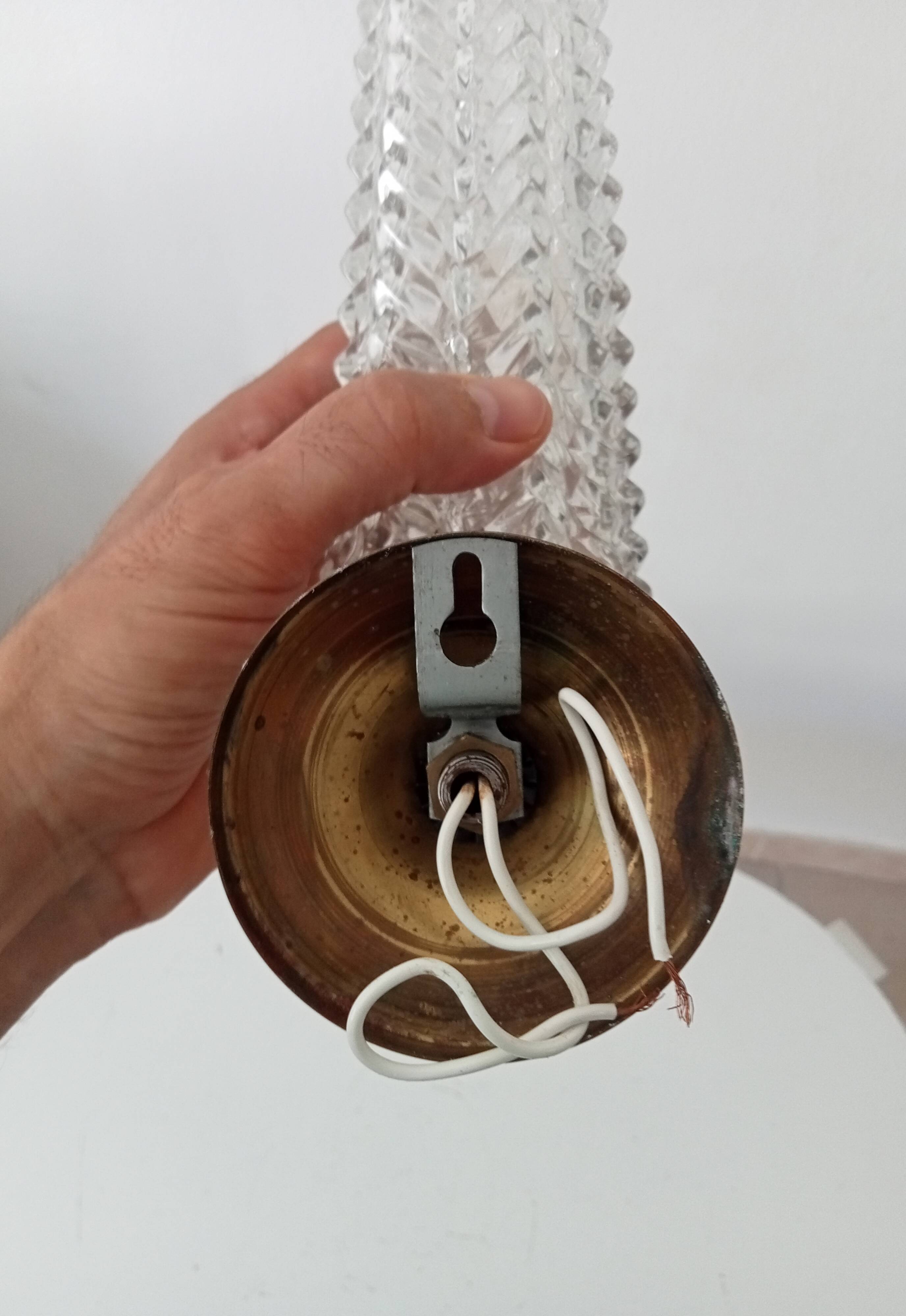 Vintage wall light in brass and etched glass.