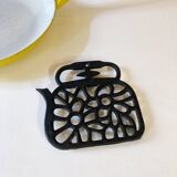 Old enameled cast iron trivet