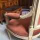 Patinated armchair in Louis XVI style