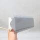 Modernist wall light with a grey pivoting shade from the 1980s.