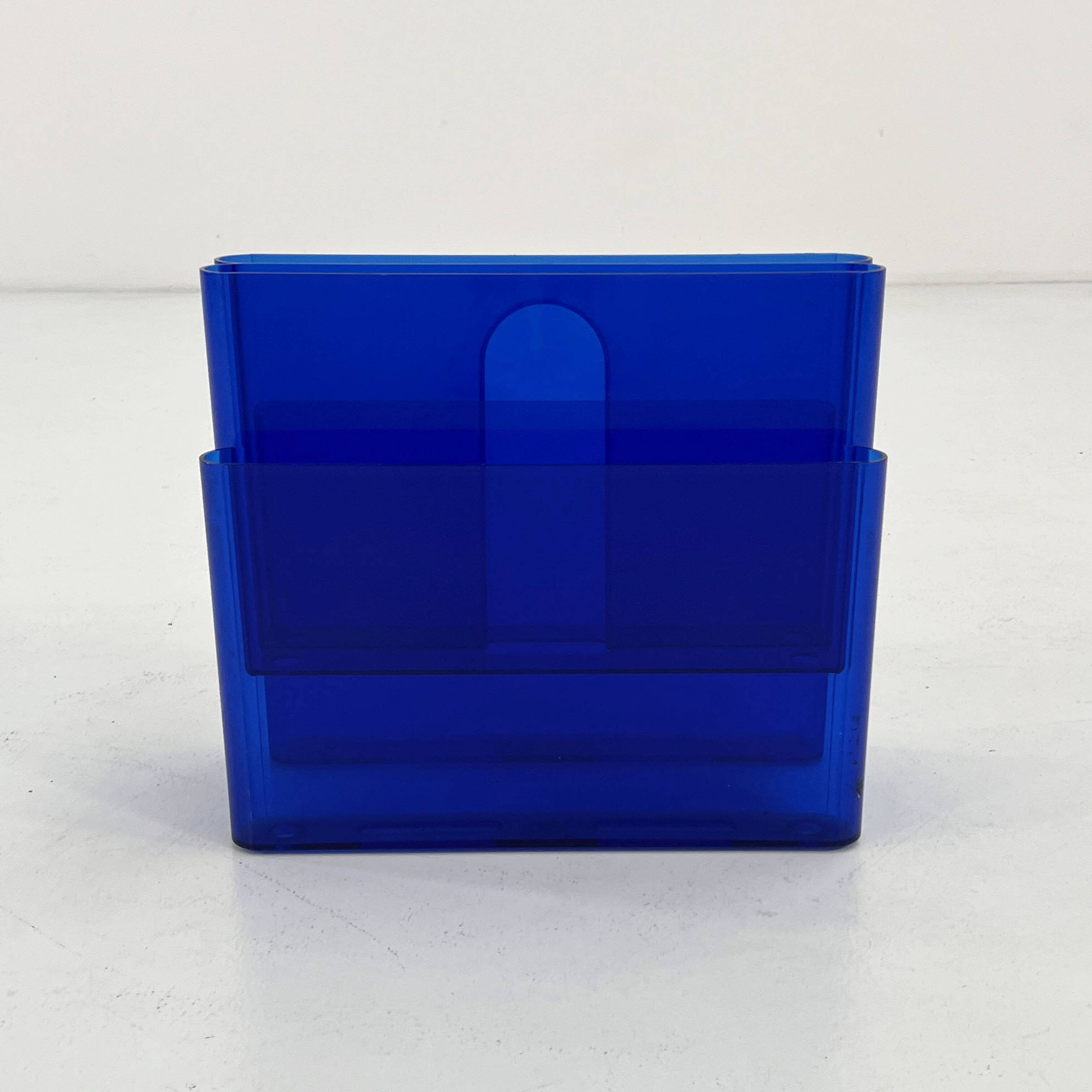 Blue transparent magazine rack by Giotto Stoppino for Kartell, 1970.