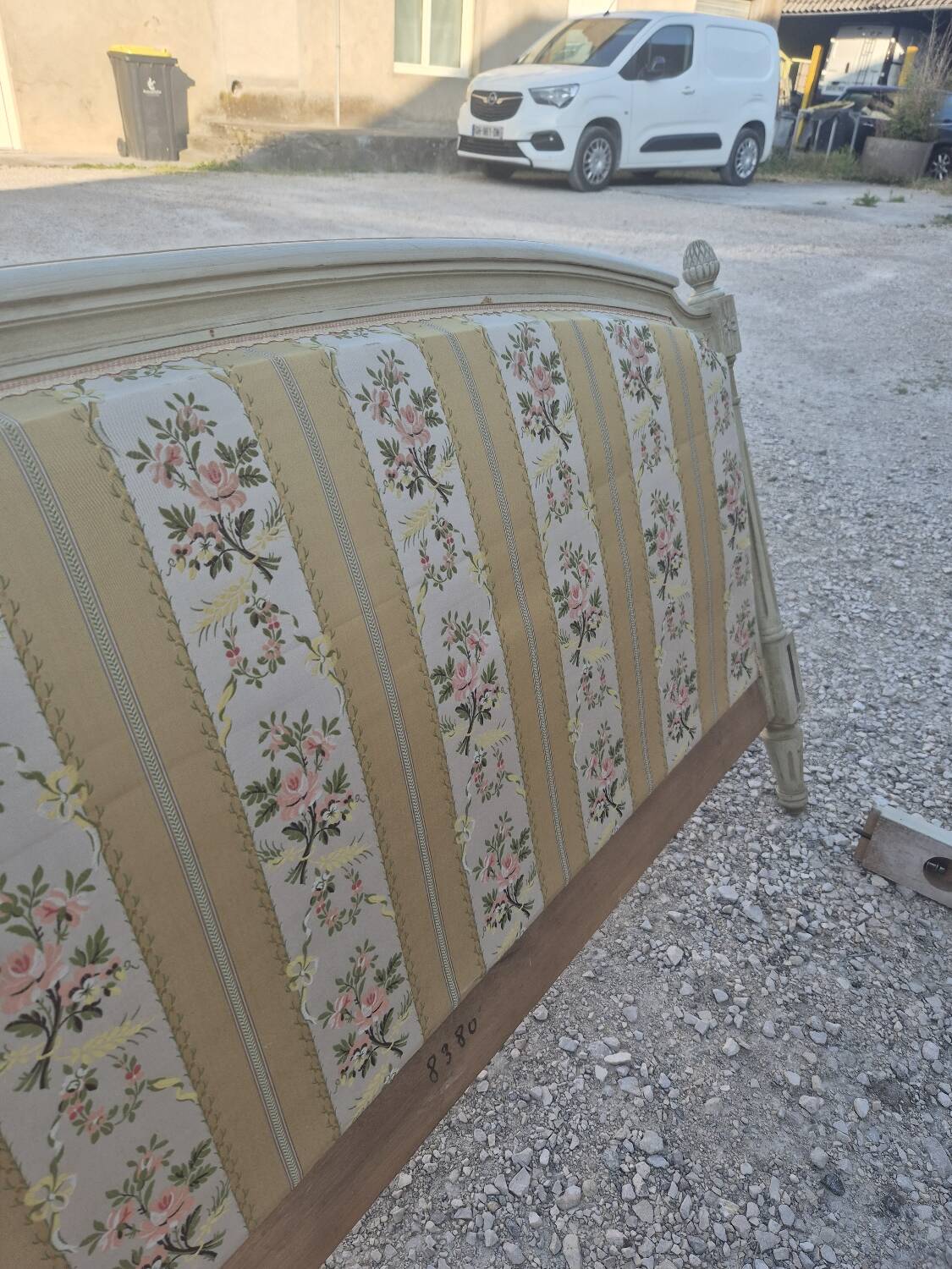 Louis XVI style bed richly decorated in patinated wood.