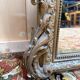 Miroir Napoléon III en bois et stuc doré