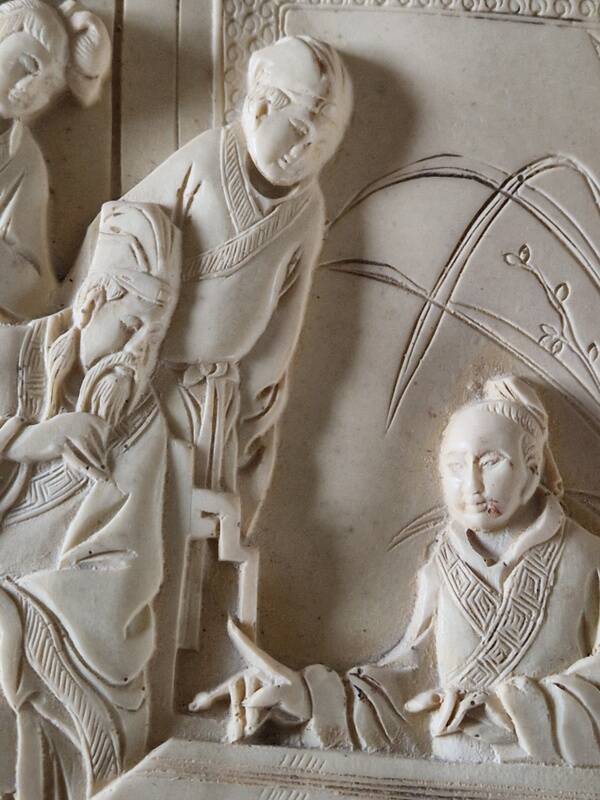 Sculpted resin plaque in the style of China.