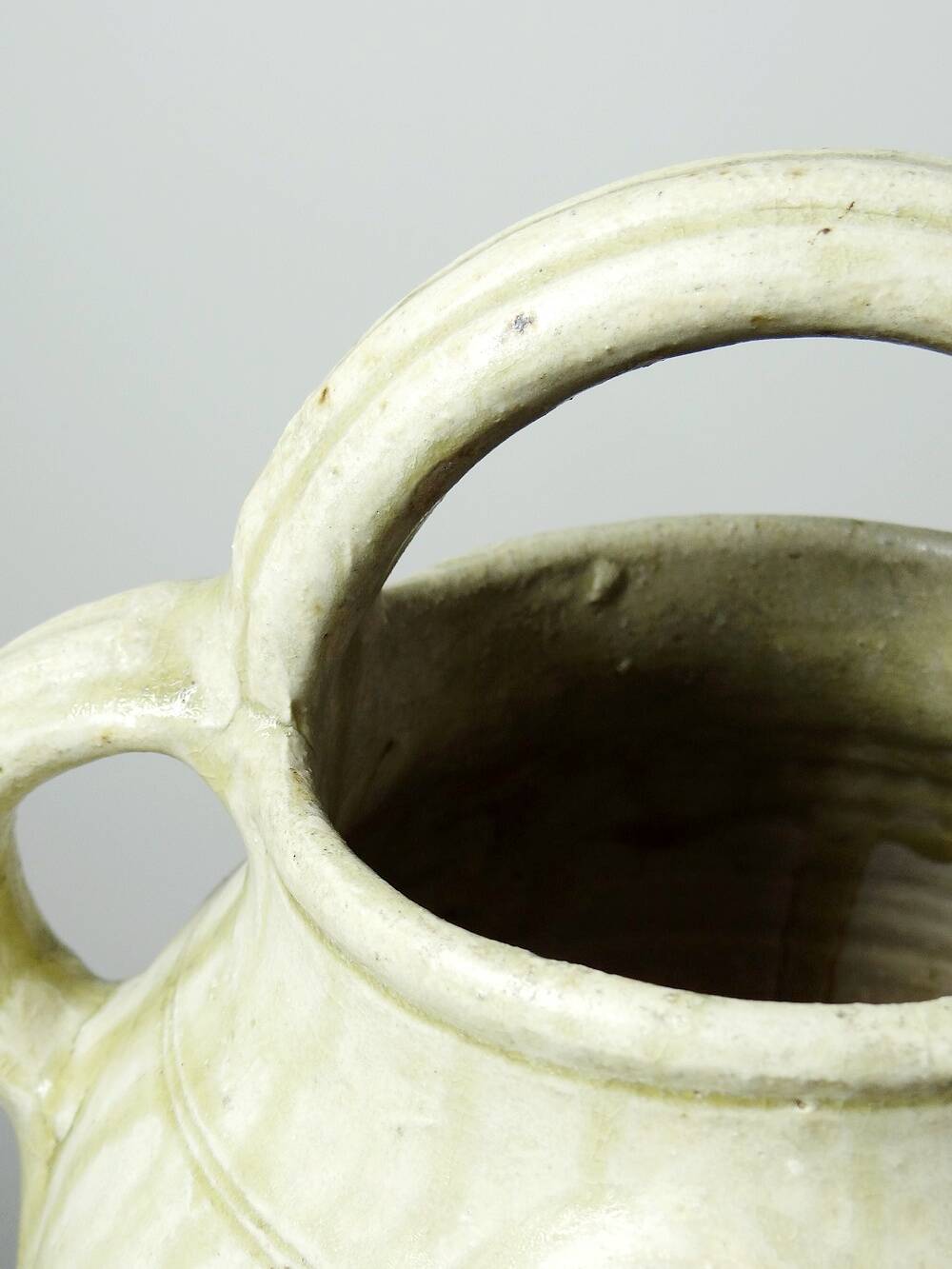Green ash-glazed stoneware casserole from Puisaye, late 19th to early 20th century.