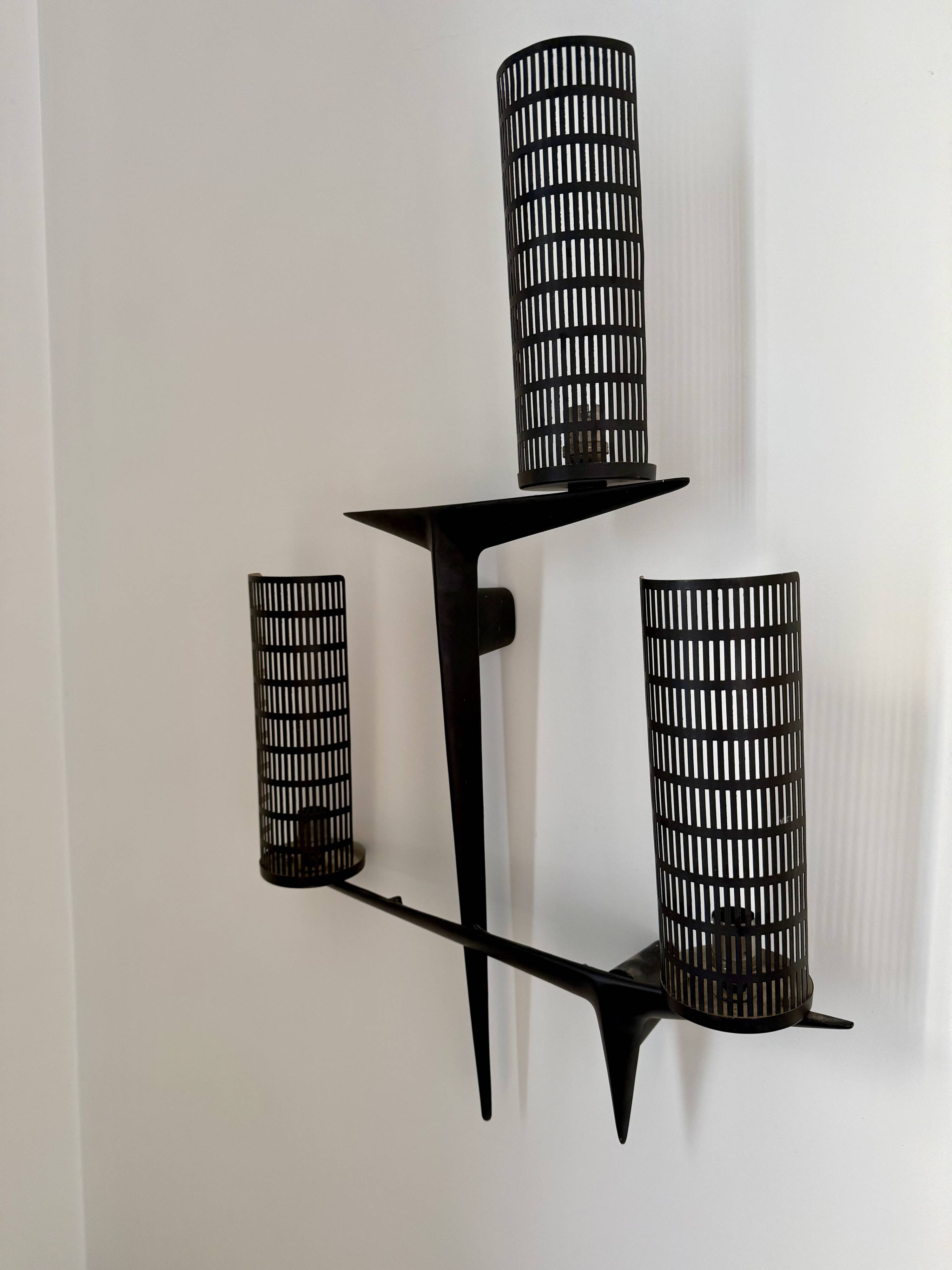 Pair of sculpted lacquered bronze wall lights, Arlus