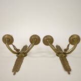 Pair of two-armed Empire wall sconces in gilded bronze