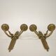 Pair of two-armed Empire wall sconces in gilded bronze