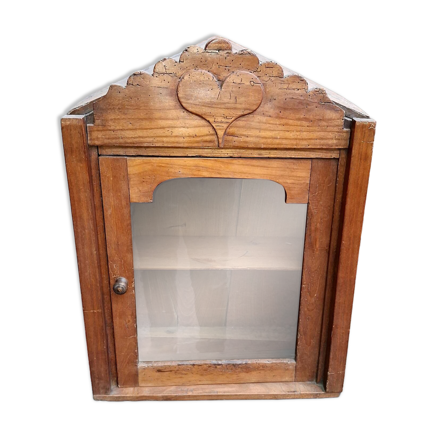 Showcase of popular art in solid wood, carved heart.