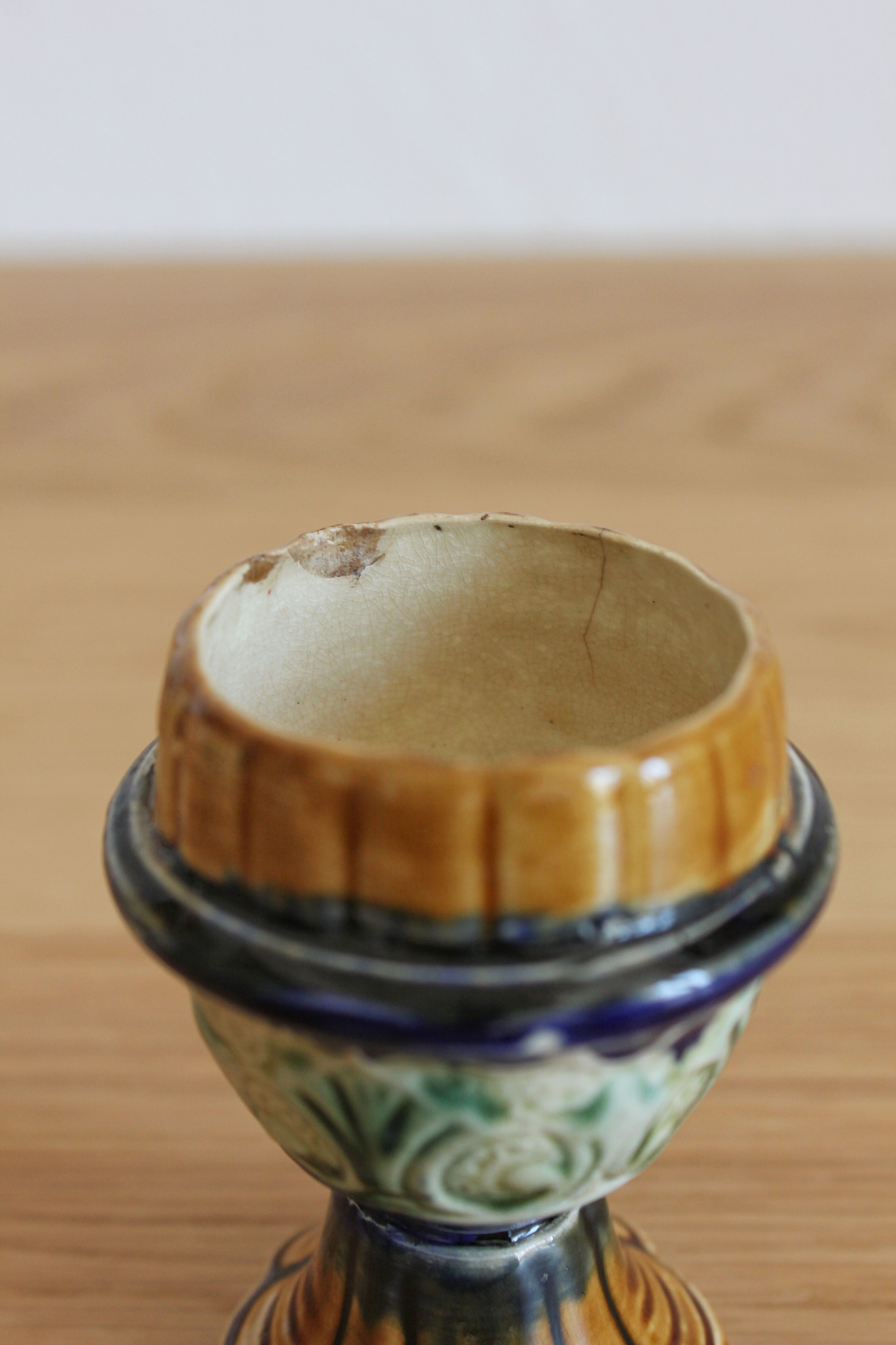 Late 19th-century earthenware egg cup in slipware