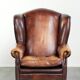 Comfortable cowhide wingback armchair in English style