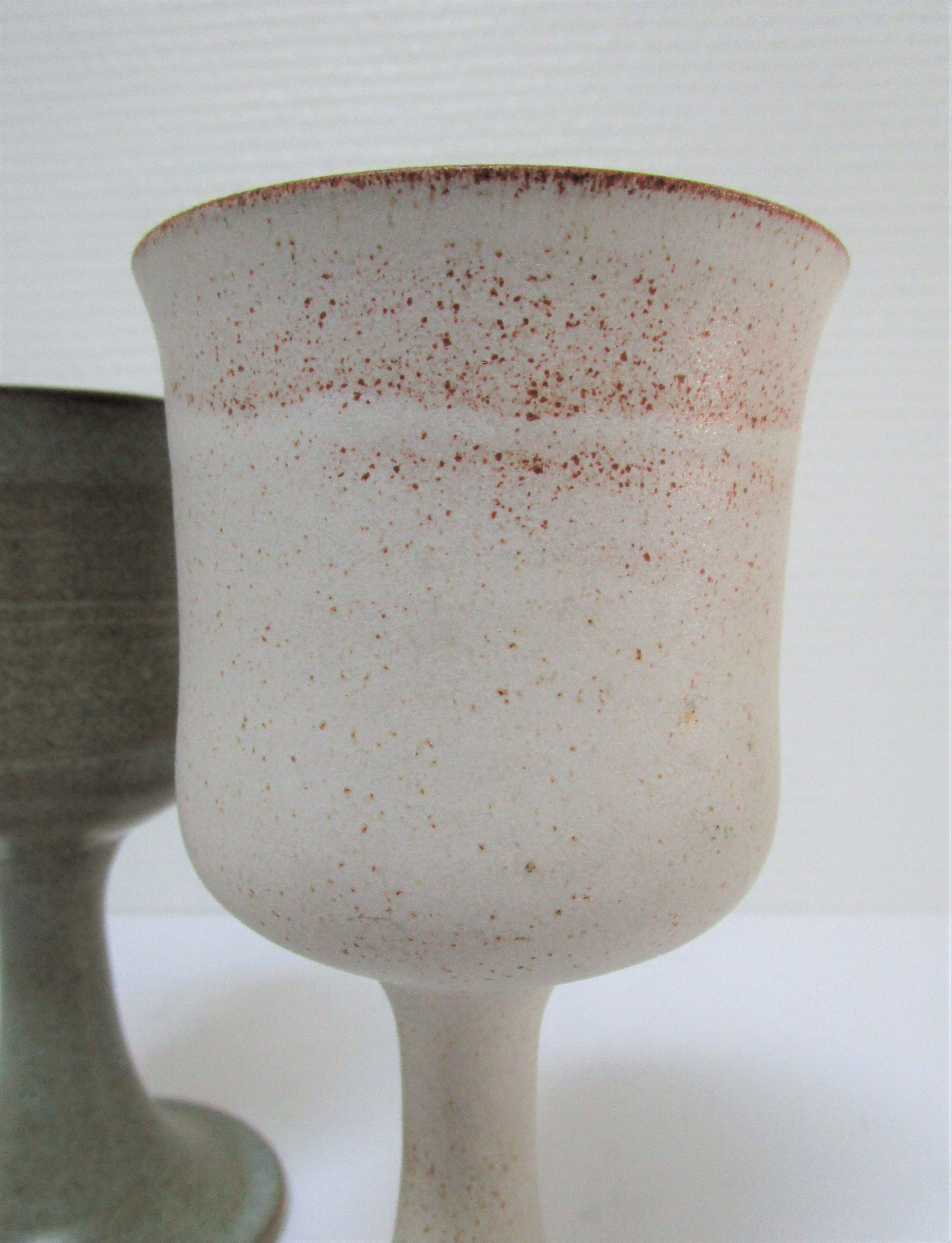 Two enamelled ceramic walking glasses