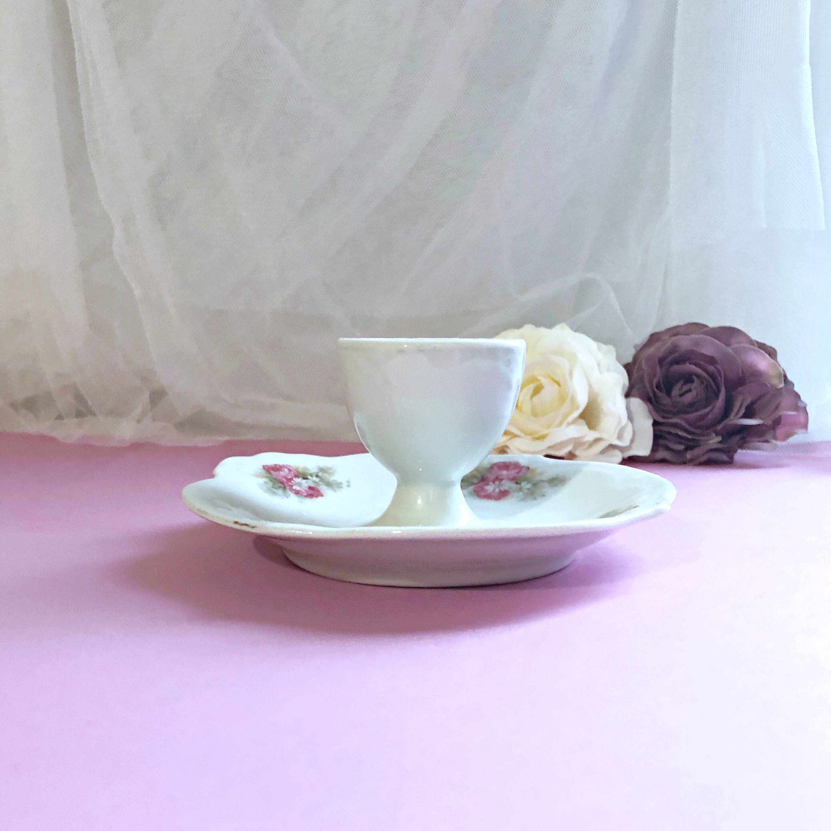 Porcelain egg cup with shabby chic style floral bouquet decoration Romanticism