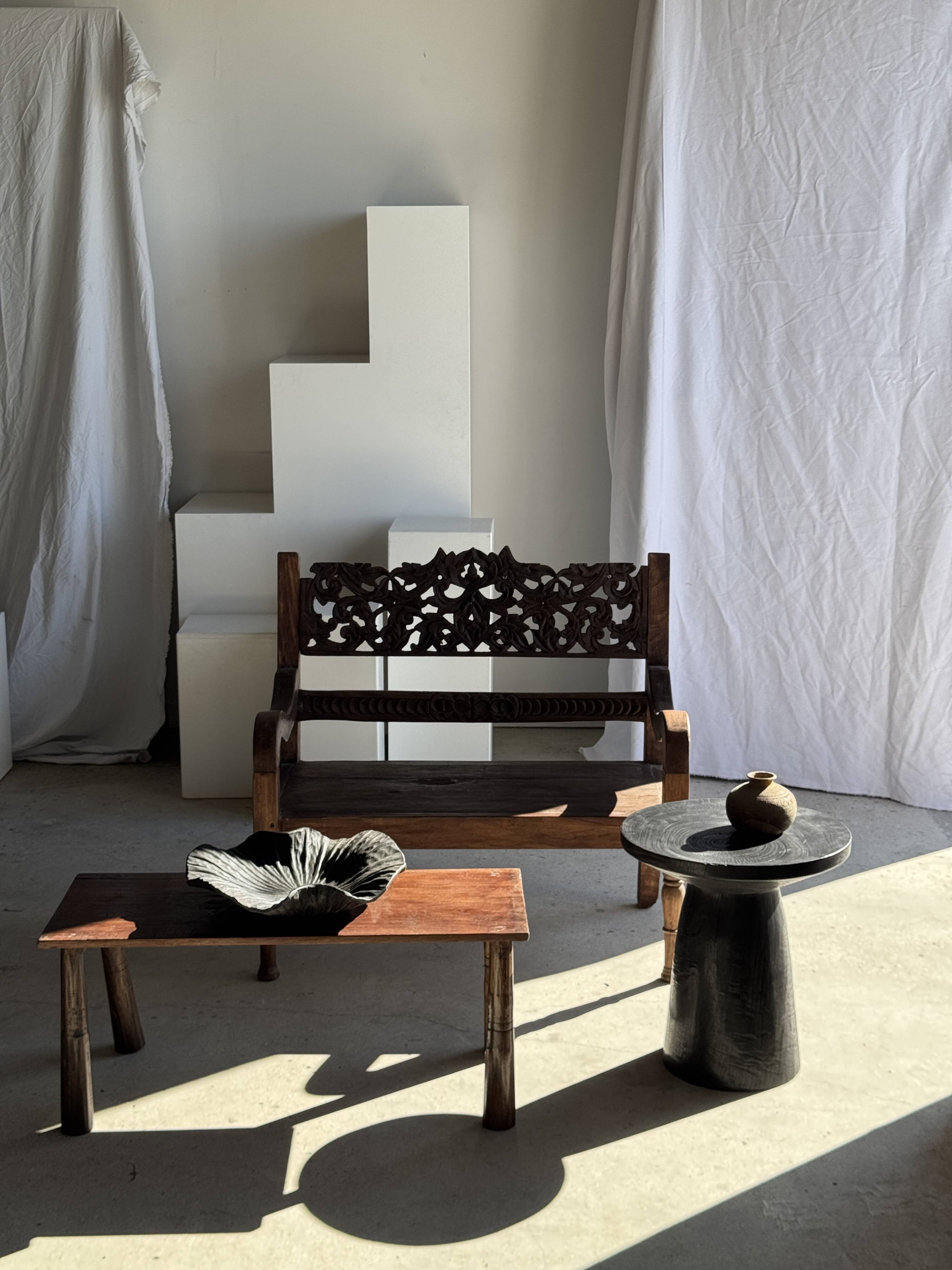 Black solid mango side table (monoxyle) with conical legs