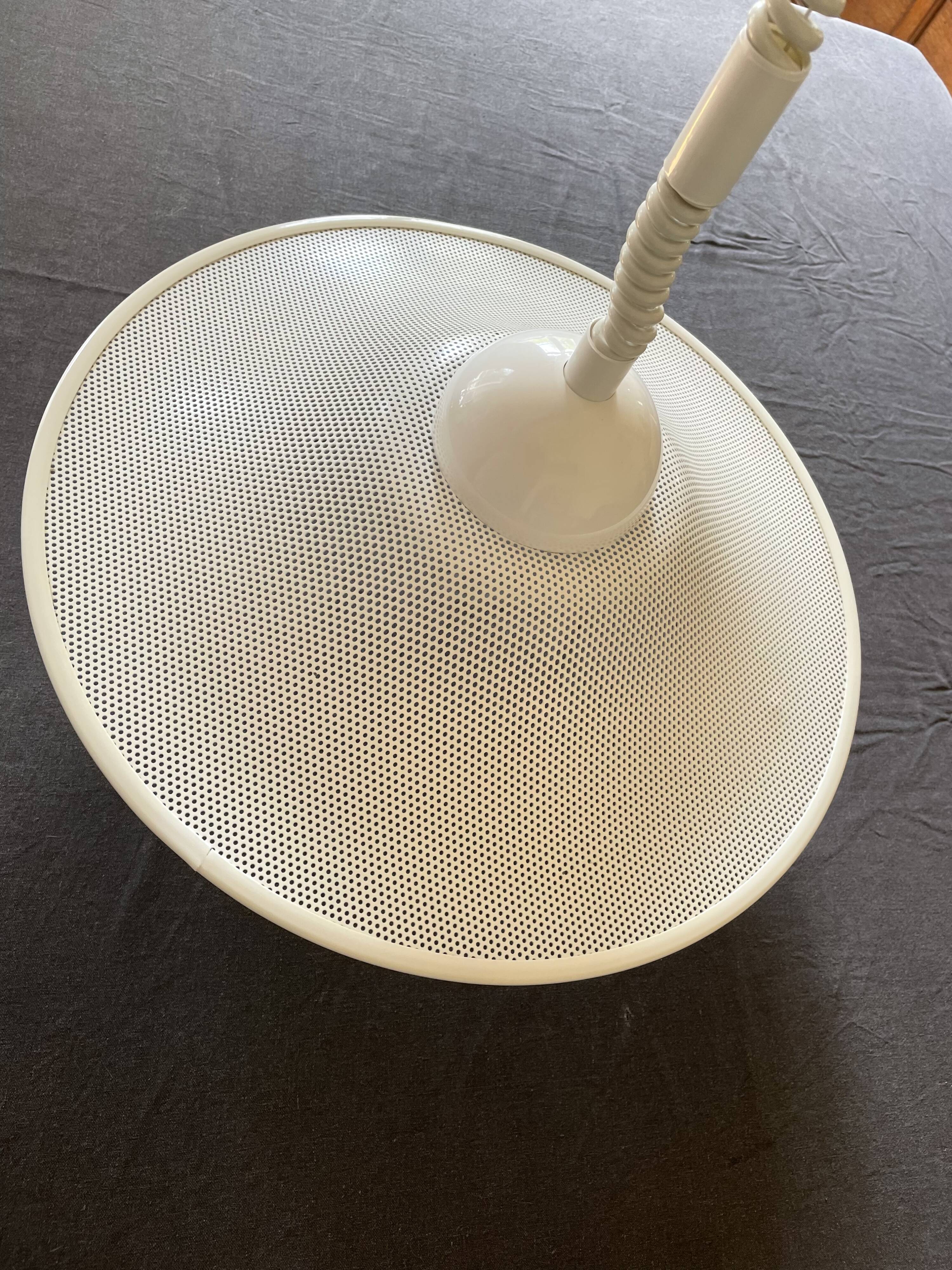 Suspension of the 80s in perforated white metal