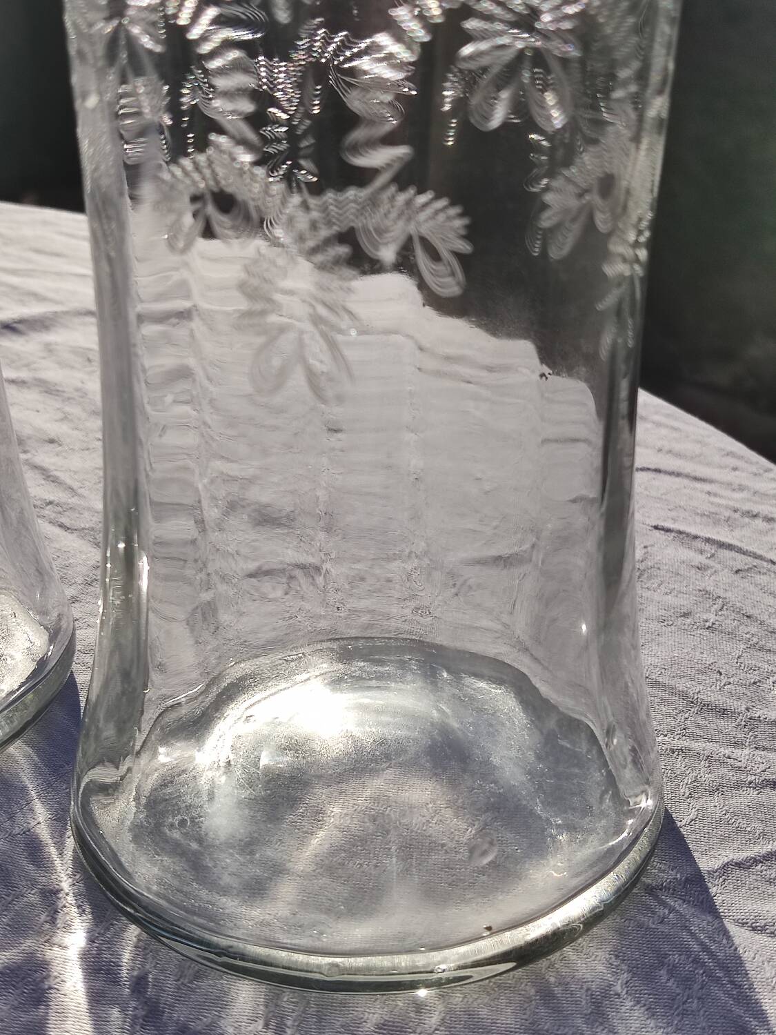 Two antique engraved glass bottles