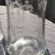 Two antique engraved glass bottles