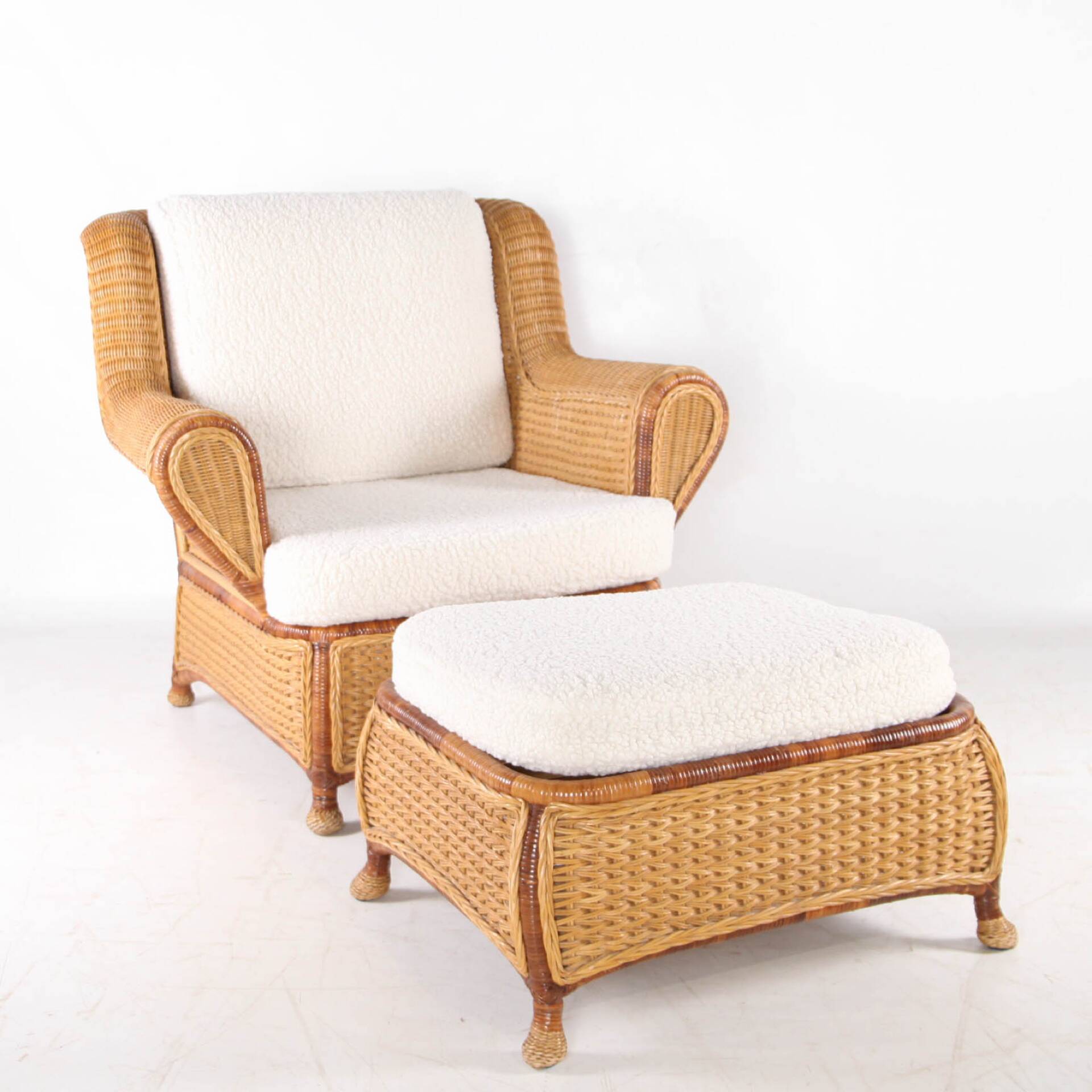 Large wicker armchair and its ottoman