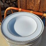 Twelve white porcelain plates