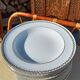 Twelve white porcelain plates
