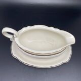 Porcelain sauce boat with black and gold checkered border