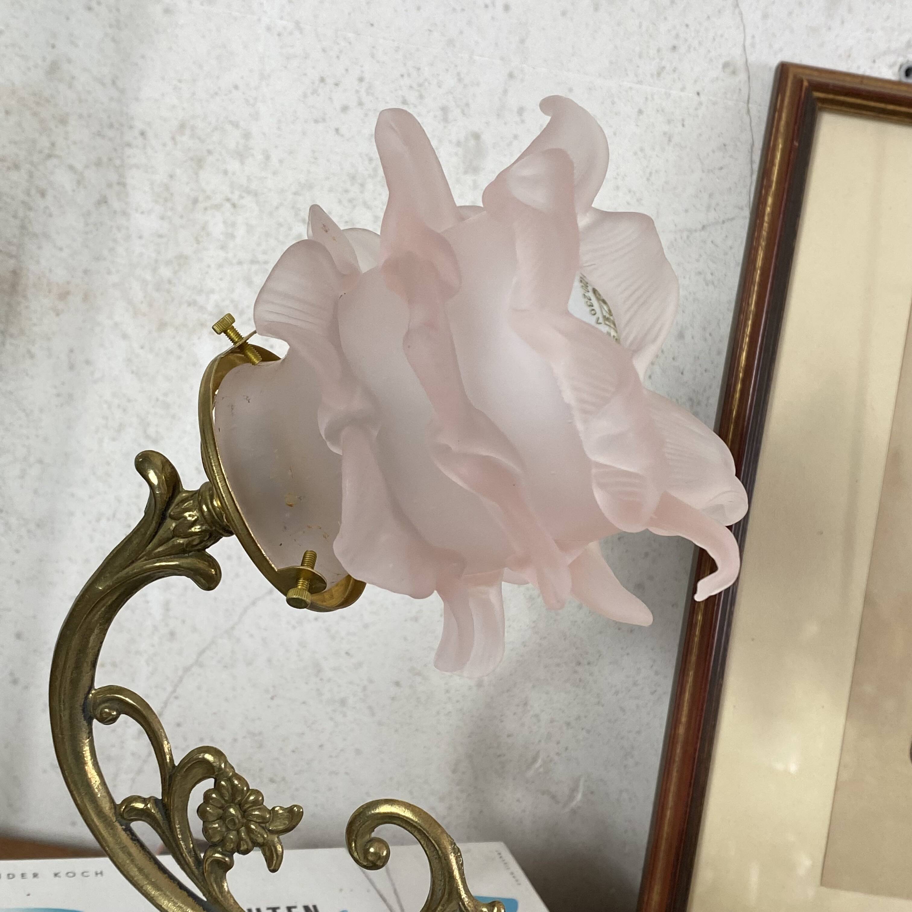 Swan neck wall light in brass with rose petal glass shade.