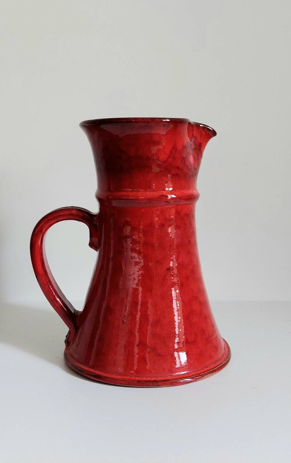 Handcrafted glazed terracotta pitcher