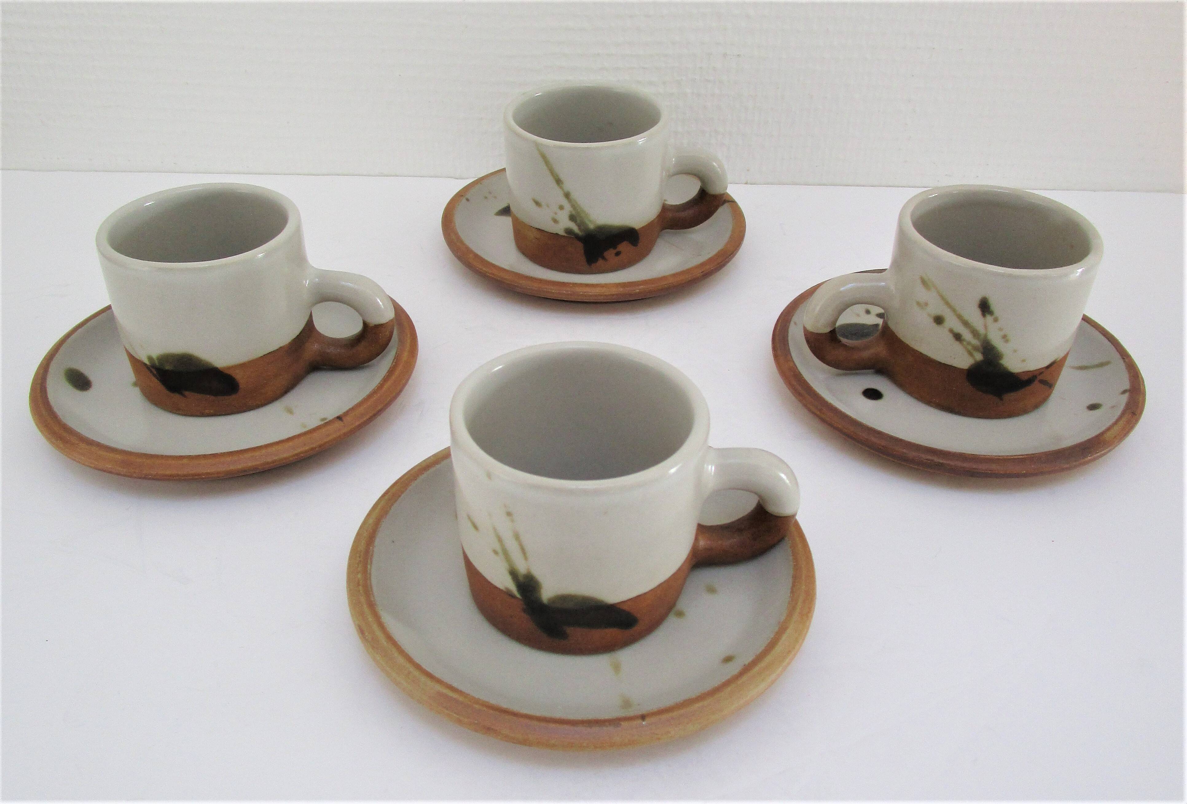 Four pottery cups and saucers from La Colombe Vallauris