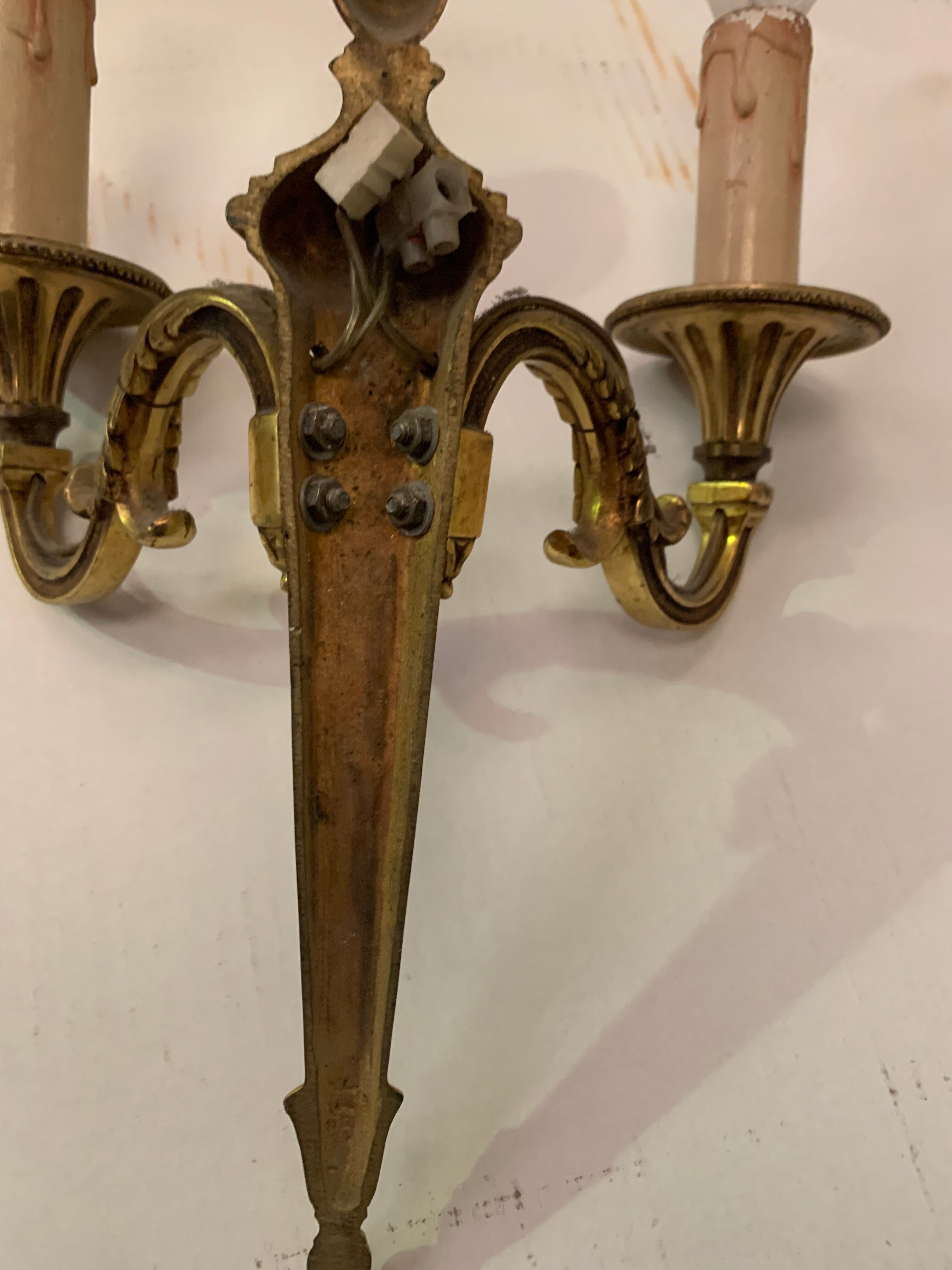 Pair of Louis XV style sconces in gilded bronze XX century