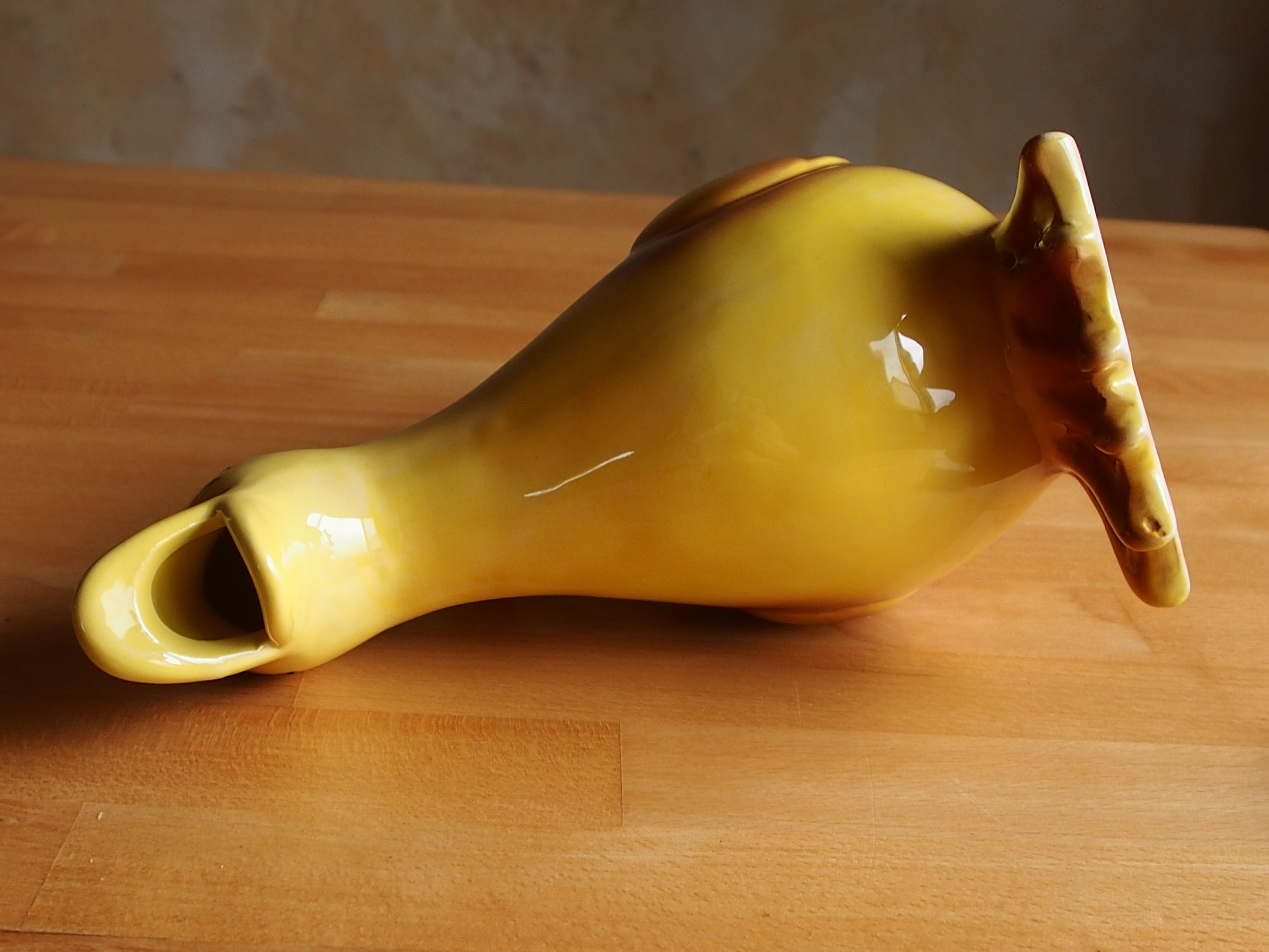 Ceramic watering can in white earthenware, yellow enamel and bird shape