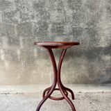 Pedestal table in curved wood