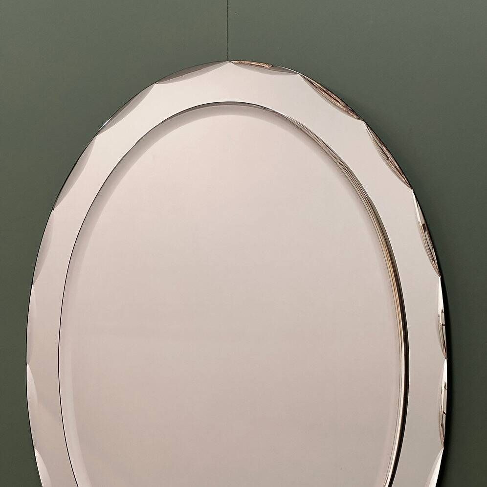 1970s Italian oval mirror by Crystal Arte with faceted glass frame