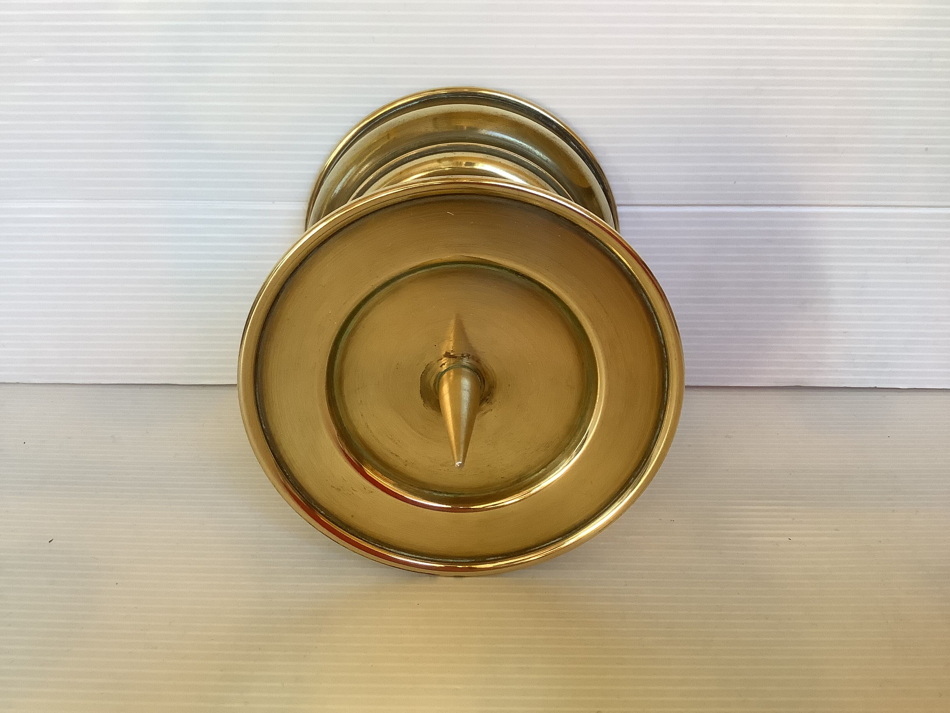 Old brass candle pique