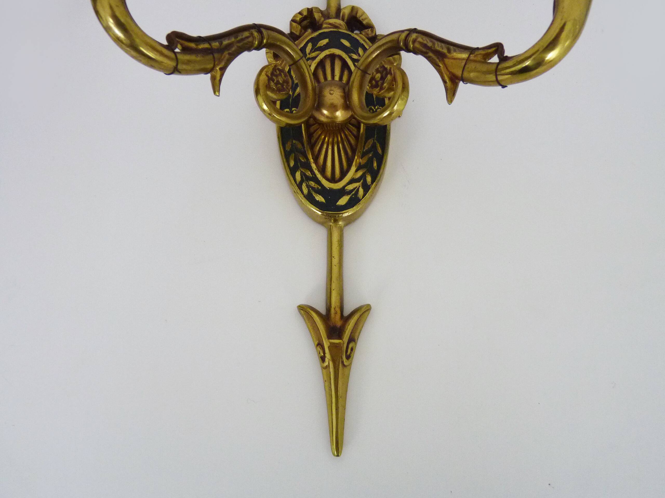 Pair of double-light Empire style arrow wall lights in bronze. Early 20th century