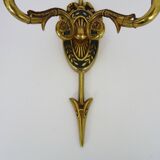 Pair of double-light Empire style arrow wall lights in bronze. Early 20th century