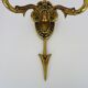 Pair of double-light Empire style arrow wall lights in bronze. Early 20th century
