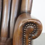Sheep leather armchair finished with decorative nails