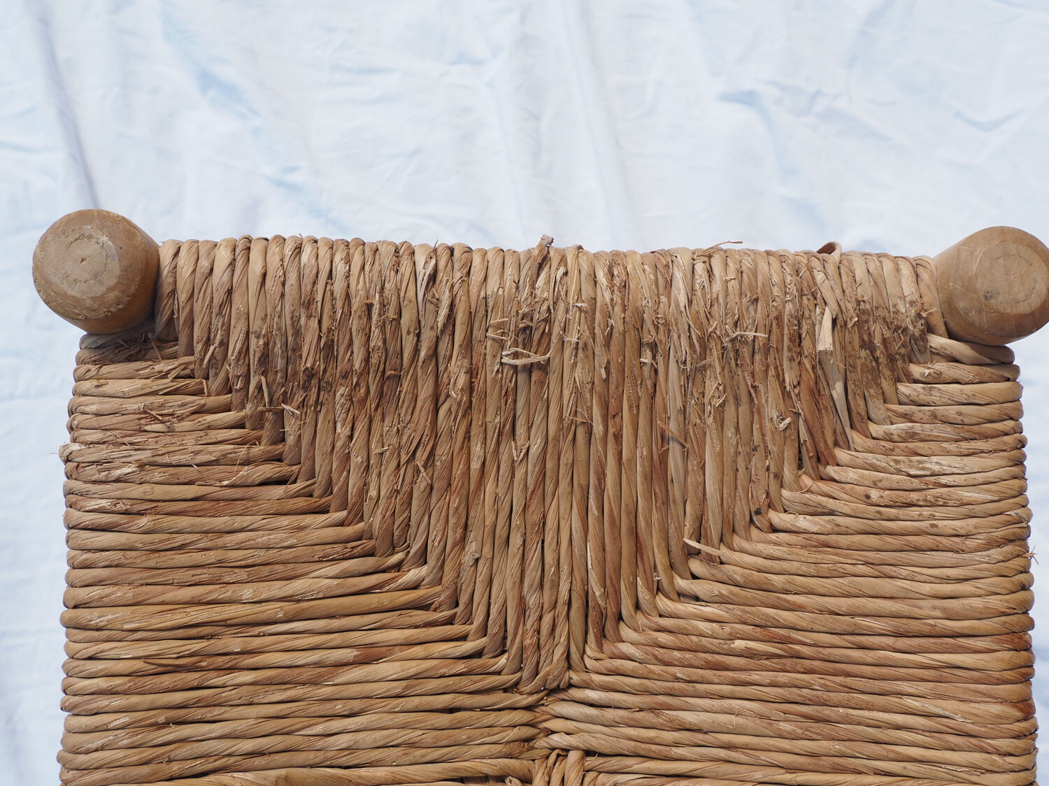 Farm stool made of wood and straw