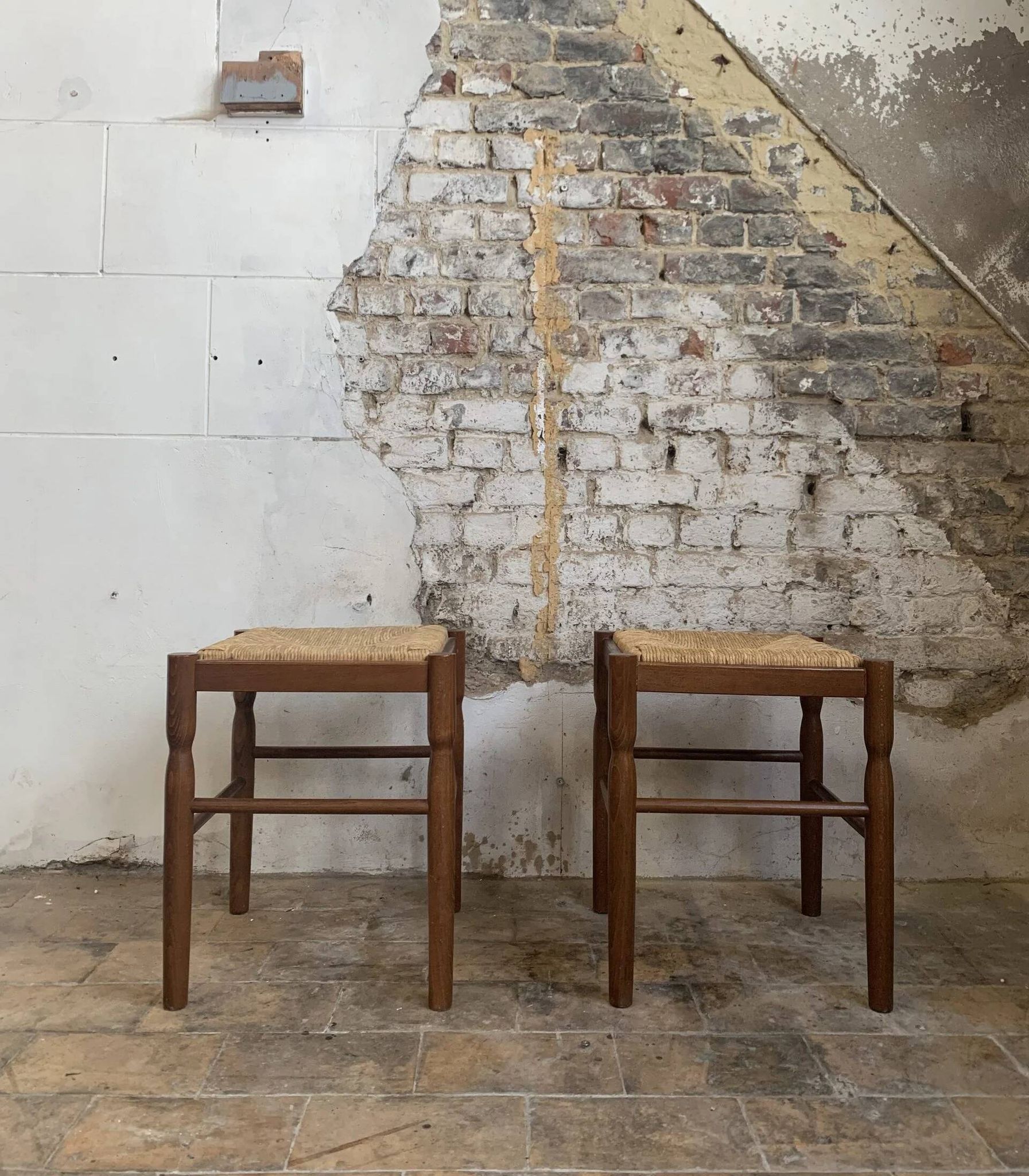 Pair of 20th-century wooden stools with straw seats