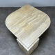 Table basse travertin forme œil par Roche Bobois