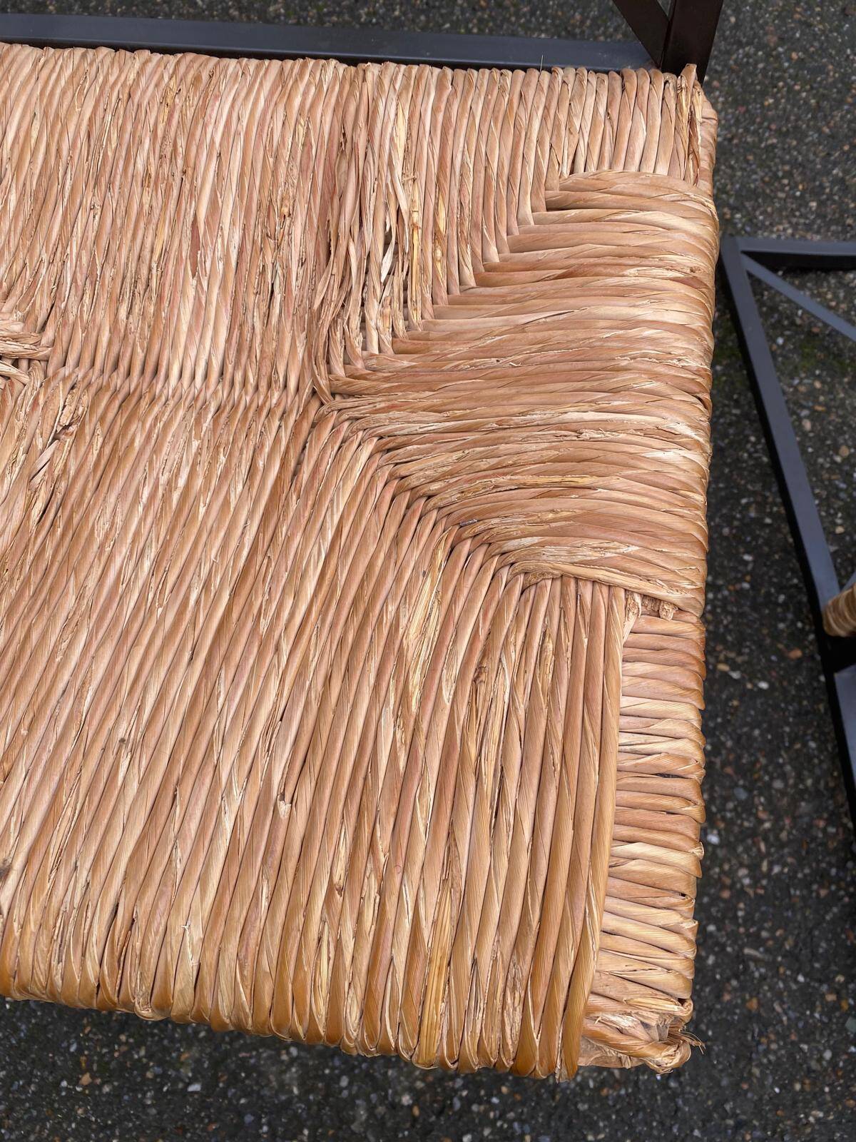 2 Scandinavian chairs with black steel and straw from IKEA Granas.