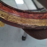 Golden oval art deco mirror