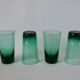Set of a carafe and 4 designer glasses in green glass from the 70s