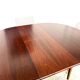 Danish round dining table in rosewood – 1950s design with butterfly extension.